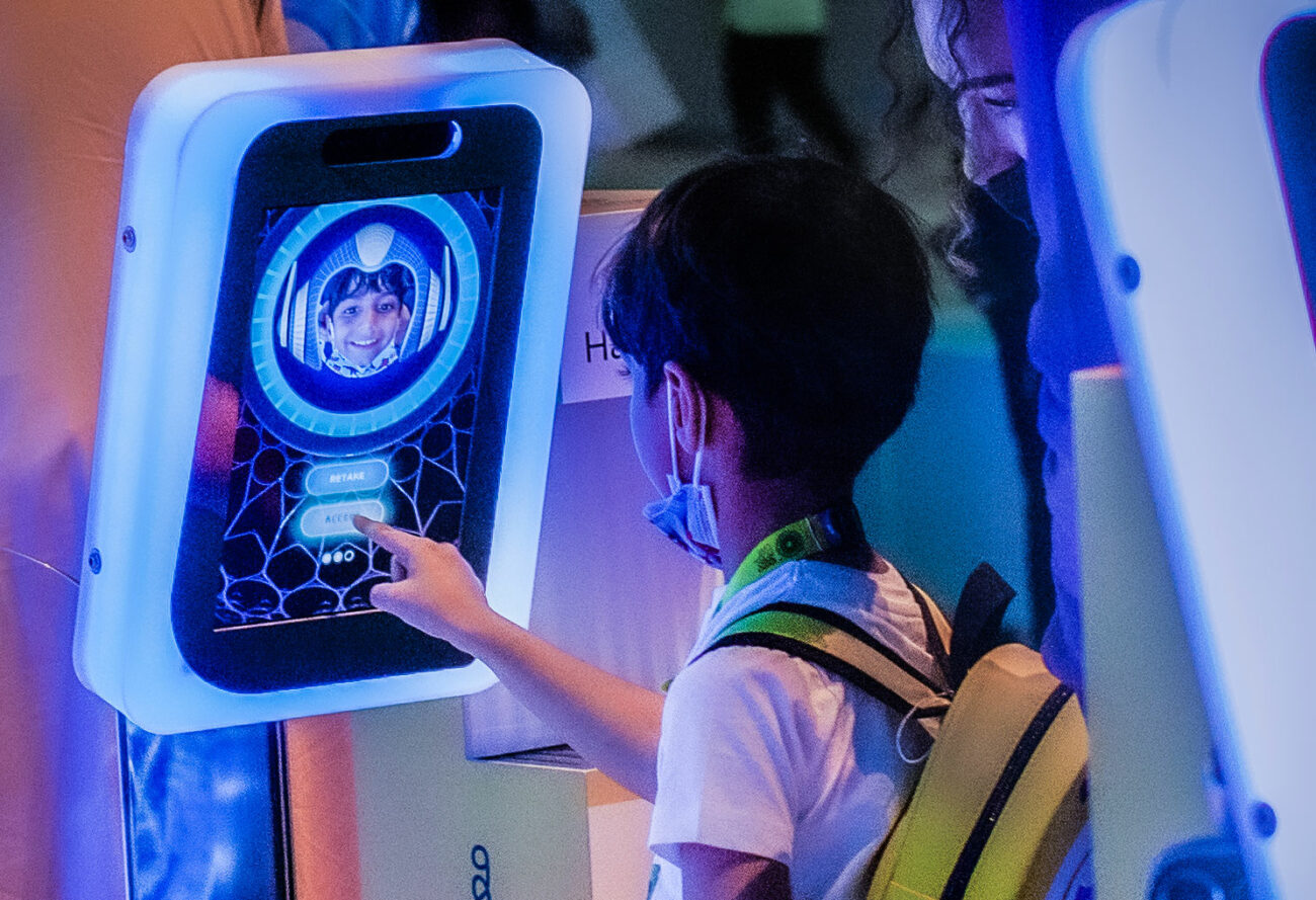 08_WorldExpo_BecomeAGuardian_ChildInteracts-1300×889-1